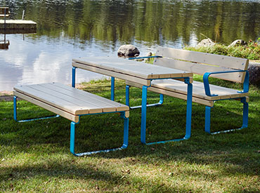 park picnic table and bench next to lake